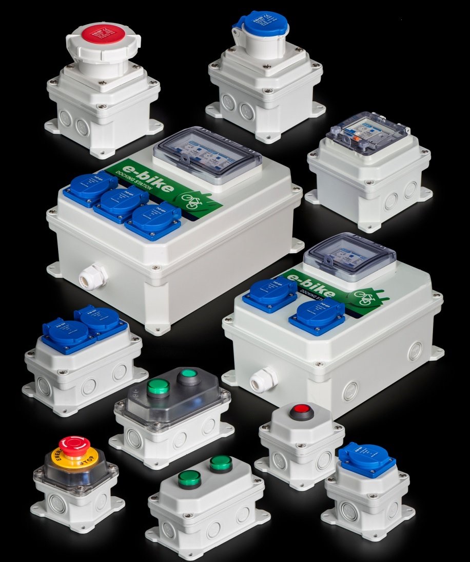 Protected electrical control boxes and socket enclosures on a dark background