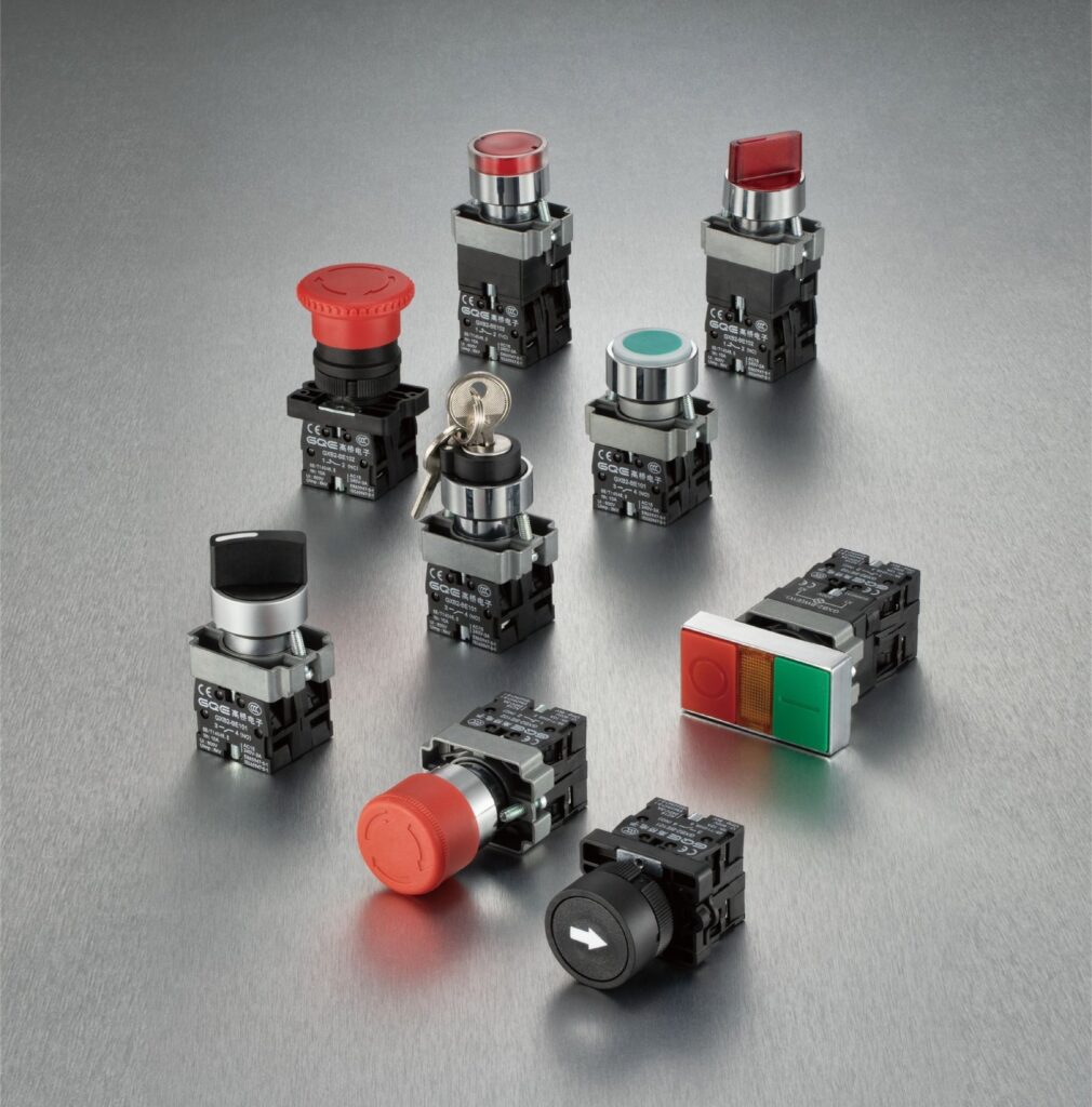 Industrial pushbuttons and selector switches arranged on a graphite work surface